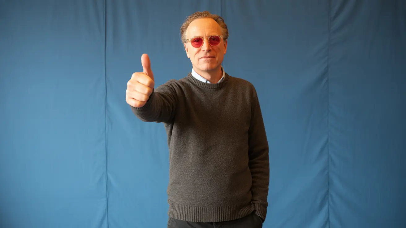 Simon Cowell smiling with a backdrop of animal welfare campaign visuals